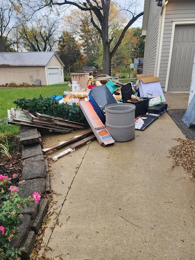 Dumpster being loaded with debris for 10 Yard Dumpster Rental in Richmond